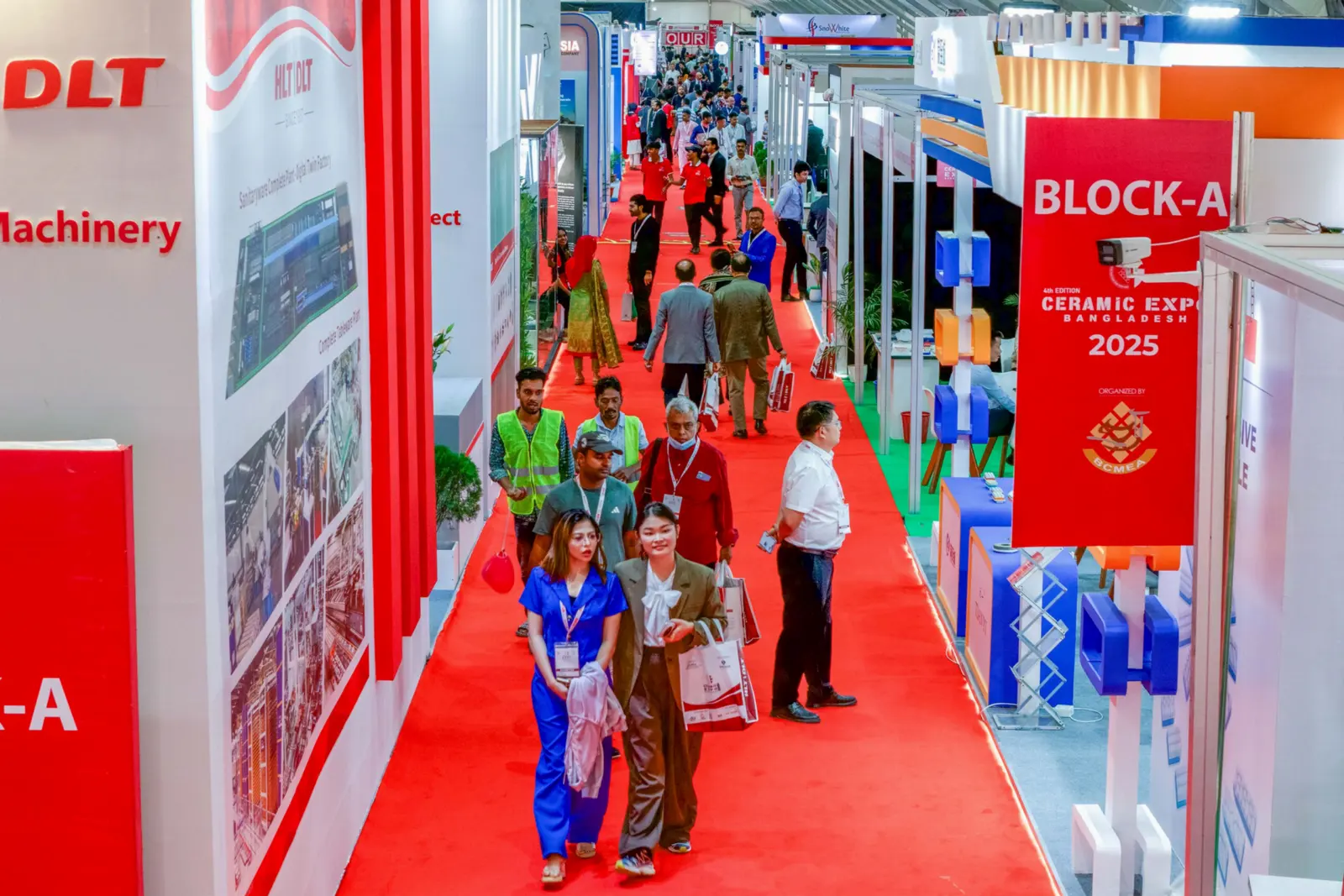 Buyers and exhibitors networking in the expo aisle